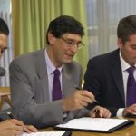 BWF President Poul-Erik Høyer Larsen (right) signs the agreement with Total energy