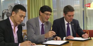 BWF President Poul-Erik Høyer Larsen (right) signs the agreement with Total energy