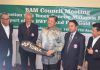 Morshidi (centre) receiving the Datuk Lee Chong Wei autographed racquet from Tengku Mahaleel (second left) yesterday. Also seen are Aziz (second right) and other BAM officials.