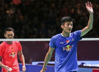 Chen Long (blue shirt) waves at the crowd after he won his All England semi-final match against Lin Dan