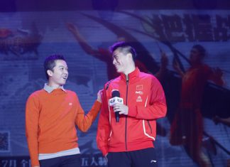 Taufik Hidayat interacts with Fu Haifeng on stage