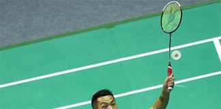 Lin Dan returns a shot at the Badminton Asia Championships
