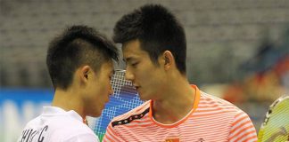 Chen Long (right)shakes hands with Taiwan's Chou Tien Chen after the 2015 Taipei GPG men's singles final match. (photo: AP)
