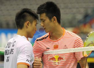Chen Long (right)shakes hands with Taiwan's Chou Tien Chen after the 2015 Taipei GPG men's singles final match. (photo: AP)