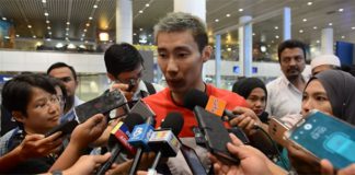 Lee Chong Wei talks to reporters upon his arrival in Kuala Lumpur.