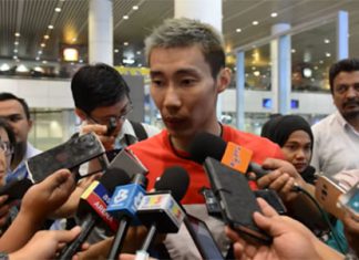 Lee Chong Wei talks to reporters upon his arrival in Kuala Lumpur.