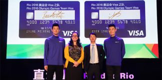 Chen Long (left) and Zhang Peimeng (right) with Visa's management team.