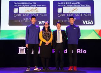 Chen Long (left) and Zhang Peimeng (right) with Visa's management team.