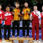 (L-R) Silver medalists Chayut Triyachart and Danny Bawa Chrisnanta of Singapore, gold medalists Tan Wee Kiong and Goh V Shem of Malaysia and bronze medalists Peter Mills and Chris Langridge of England at Glasgow 2014 Commonwealth Games.