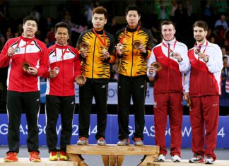 (L-R) Silver medalists Chayut Triyachart and Danny Bawa Chrisnanta of Singapore, gold medalists Tan Wee Kiong and Goh V Shem of Malaysia and bronze medalists Peter Mills and Chris Langridge of England at Glasgow 2014 Commonwealth Games.