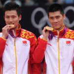 Cai Yun and Fu Haifeng (right) of China stand on the podium with their gold medals at the London 2012 Olympic Games.