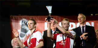Mathian Boe (L) and Carsten Mogensen (R) of Denmark lift the 2013 London Badminton Grand Prix trophy.