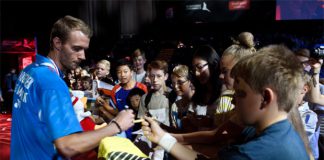 Carsten Mogensen signs autographs for fans.