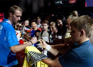 Carsten Mogensen signs autographs for fans.