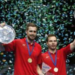 Vladimir Ivanov/Ivan Sozonov of Russia hold up the 2016 All England men’s doubles champion trophy during the awarding ceremony.(photo: Reuters / Andrew Boyers)