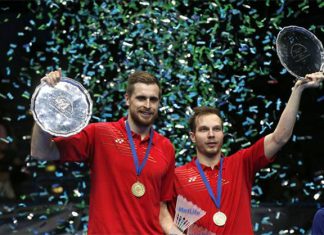 Vladimir Ivanov/Ivan Sozonov of Russia hold up the 2016 All England men's doubles champion trophy during the awarding ceremony.(photo: Reuters / Andrew Boyers)