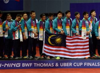 Members of the Malaysia men's badminton team pose on the podium as runners-up following a 2-3 defeat to Japan in the 2014 Thomas Cup final. (photo: GettyImages)