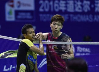 Iskandar Zulkarnain shakes hand with Lee Dong Keun after the match on Tuesday.