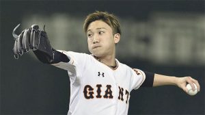 Kento Momota throws out the ceremonial first pitch prior to a game between the Central League clubs Yomiuri Giants and Yakult Swallows at the Tokyo Dome in the capital's Bunkyo Ward on March 25, 2016. (photo: Getty)