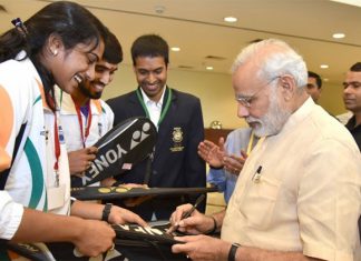 P.V Sindhu and Kidambi Srikanth get autograph from Prime Minister Narendra Modi. (photo: business-standard)