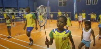 Brazilian children are practicing badminton following the Samba beat. (photo: New York Times)