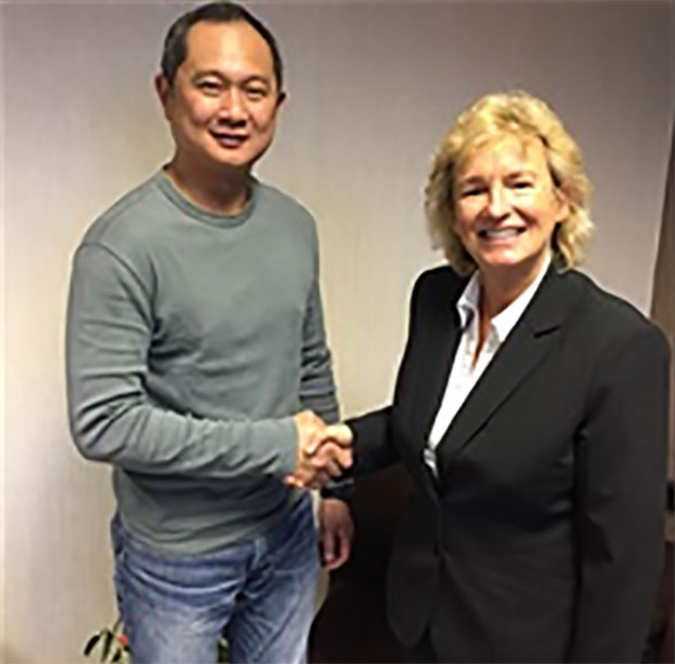 Chief Executive of Badminton Scotland, Anne Smillie welcomes Wong Tat Meng to the Scotland badminton team. (photo: Badminton Scotland) Chief Executive of Badminton Scotland, Anne Smillie welcomes Wong Tat Meng to the Scotland badminton team. (photo: Badminton Scotland)