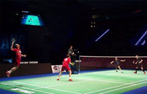 Carsten Mogensen (red shirt, left) and Mathias Boe of Denmark play against Mark Lamsfuss and Josche Zurwonne of Germany in European Mixed Team Badminton Championships semi-final.