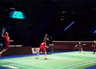 Carsten Mogensen (red shirt, left) and Mathias Boe of Denmark play against Mark Lamsfuss and Josche Zurwonne of Germany in European Mixed Team Badminton Championships semi-final.