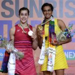 P.V. Sindhu (R) poses with Carolina Marin during the awarding ceremony for the India Open. (photo: AFP)