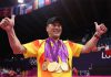Li Yongbo poses with all five gold medals won by the Chinese badminton team during the 2012 Olympics. (photo: AP)