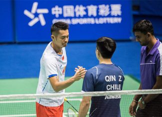 Lin Dan shakes hand with Zheng Qin before the China Masters second round match. (photo: AFP)