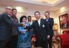 Datuk Seri Mohamad Norza Zakaria shakes hand with Tan Sri Mohamed Al-Amin Abdul Majid. (photo: Sairien Nafis)