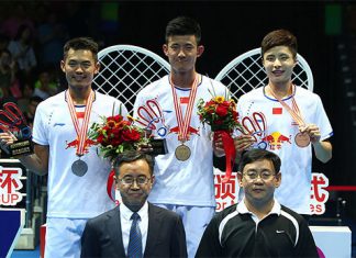 Chen Long (middle) wins his first Badminton Asia Championships in Wuhan on Sunday.
