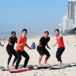 Sung Ji Hyun of Korea (from left), PV Sindhu of India, Zheng Siwei of China, Jonatan Christie of Indonesia, Misaki Matsutomo of Japan, Chen Qingchen of China and Ayaka Takahashi at Surfers Paradise Beach. (photo: Chris Hyde)