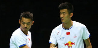 Lin Dan shakes hand with Chen Long. (photo: AP)