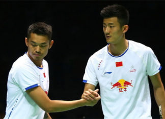 Lin Dan shakes hand with Chen Long. (photo: AP)