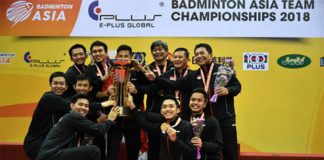 Indonesia team celebrates on the podium with the 2018 Badminton Asia Team Championships trophy. (photo: AP)