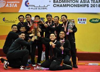 Indonesia team celebrates on the podium with the 2018 Badminton Asia Team Championships trophy. (photo: AP)