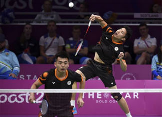 Tan Wee Kiong/Goh V Shem score the winning point for Malaysia against Scotland in the quarter-final of 2018 Commonwealth Games mixed team event. (photo: AP)