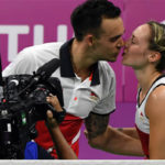 Chris and Gabby Adcock celebrate after successfully defended their mixed doubles gold medal. (photo: AP)