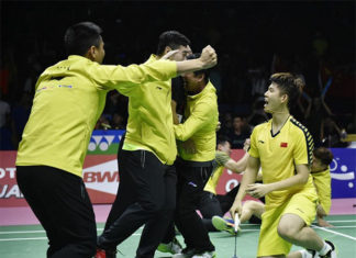 Chinese players storm the court after the Li Junhui/Liu Yuchen clinch the winning point for China. (photo: AP)