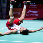 Kento Momota collapses on the court after scoring the match point. (photo: AFP)