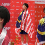 Goh Jin Wei stands on the podium for the Malaysia national anthem after winning the world junior gold. (photo: BadmintonCanada)