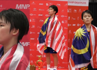 Goh Jin Wei stands on the podium for the Malaysia national anthem after winning the world junior gold. (photo: BadmintonCanada)