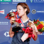Nozomi Okuhara poses on the podium after the women’s singles final match against Ratchanok Intanon. (photo: AFP)