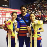 Chow Mei Kuan (R)/Lee Meng Yean (L) pose with their coach Rosman Razak after winning the 2018 Syed Modi International Badminton Championships. (photo: BAM's Facebook)