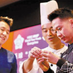 Marcus Fernaldi Gideon, Kevin Sanjaya Sukamuljo making Chinese dumpling. (photo: AFP)
