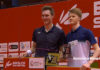 Viktor Axelsen and Anders Antonsen pose for pictures at the presentation ceremony.