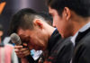 Lee wipes his tears during the press conference. (photo: AFP)