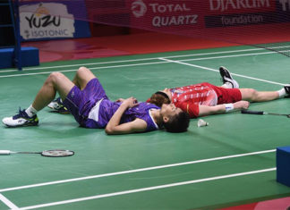 Both Chou Tien Chen (L) and Anders Antonsen lying on the court after an incredible match. (photo: Xinhua/Zulkarnain)
